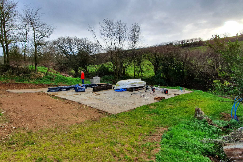 The concrete base for the new barn